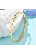 Brățară rigidă cu zirconii transparente, placată cu aur 18K