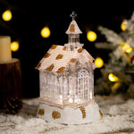 Decoratiune de Craciun, Flippy, Model Bisericuta Transparenta cu Sclipici, Iluminare LED si Efect Zapada, 22 x 13 x