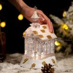 Decoratiune de Craciun, Flippy, Model Bisericuta Transparenta cu Sclipici, Iluminare LED si Efect Zapada, 22 x 13 x