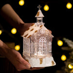 Decoratiune de Craciun, Flippy, Model Bisericuta Transparenta cu Sclipici, Iluminare LED si Efect Zapada, 22 x 13 x