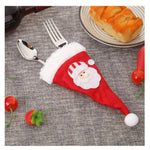 Husa decorativa festiva pentru 3 tacamuri Flippy, model caciulita cu Mos Craciun, material textil si poliester, 19 x 10