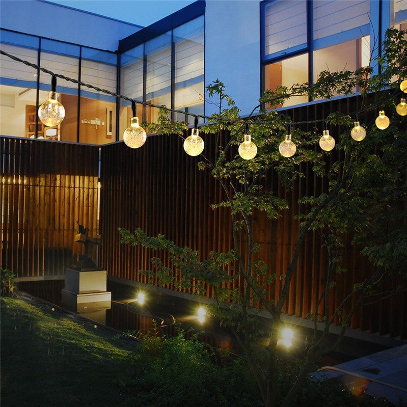 Instalatie Craciun, Tip Globuri de cristal, 50 Led-uri, 9.5 metri, Alb cald, Energie solara, Senzor de lumina, Flippy