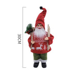 Figurina Decorativa Craciun, Flippy, Mos Craciun cu Lemne la Brat, 30 x 17 x 10 cm, Material Plastic+Textil,